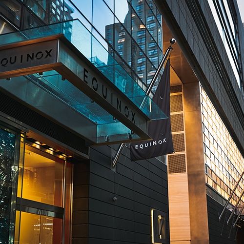 Sidewalk view of a Equinox storefront in New York City