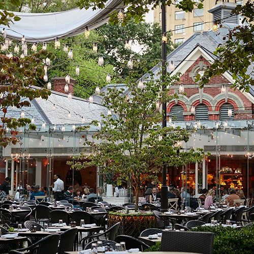 The famous outdoor seating of the Tavern on the Green restaurant